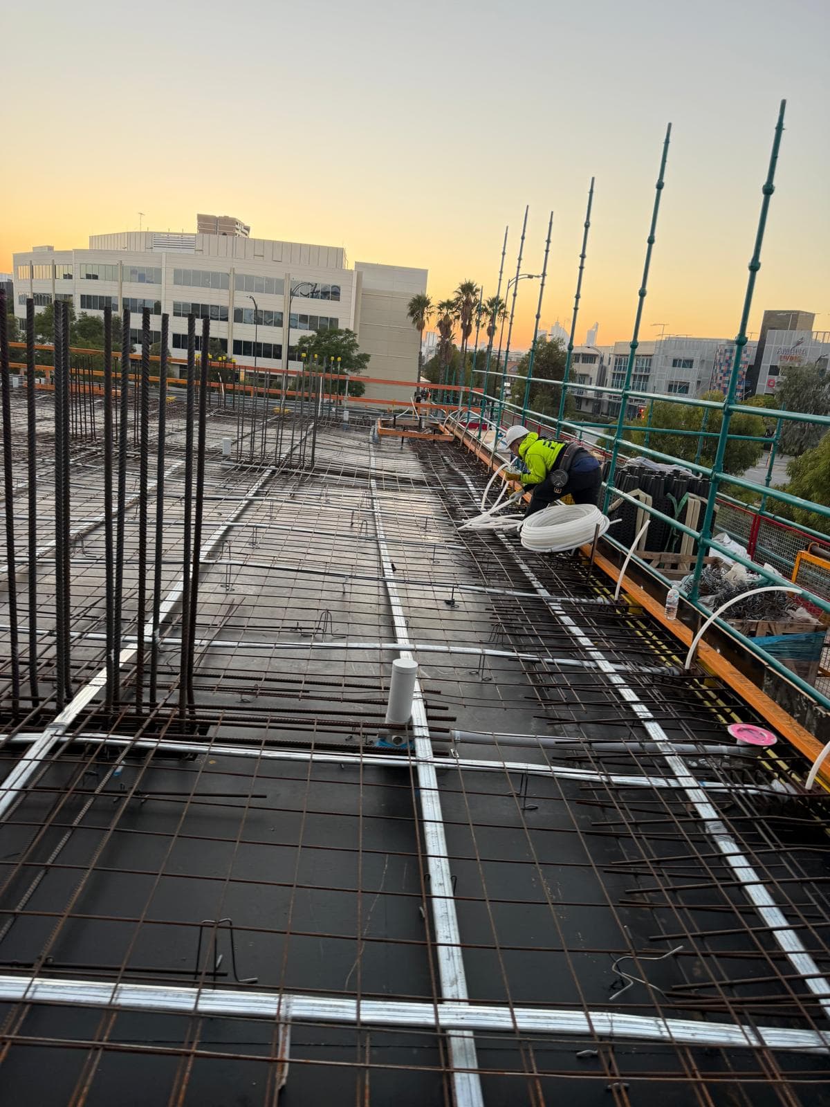 Rebar tying at sunset on Australian project