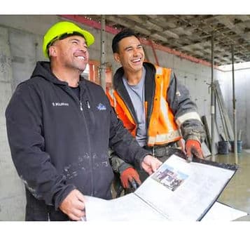 Doug and Adam reviewing plans on a construction site