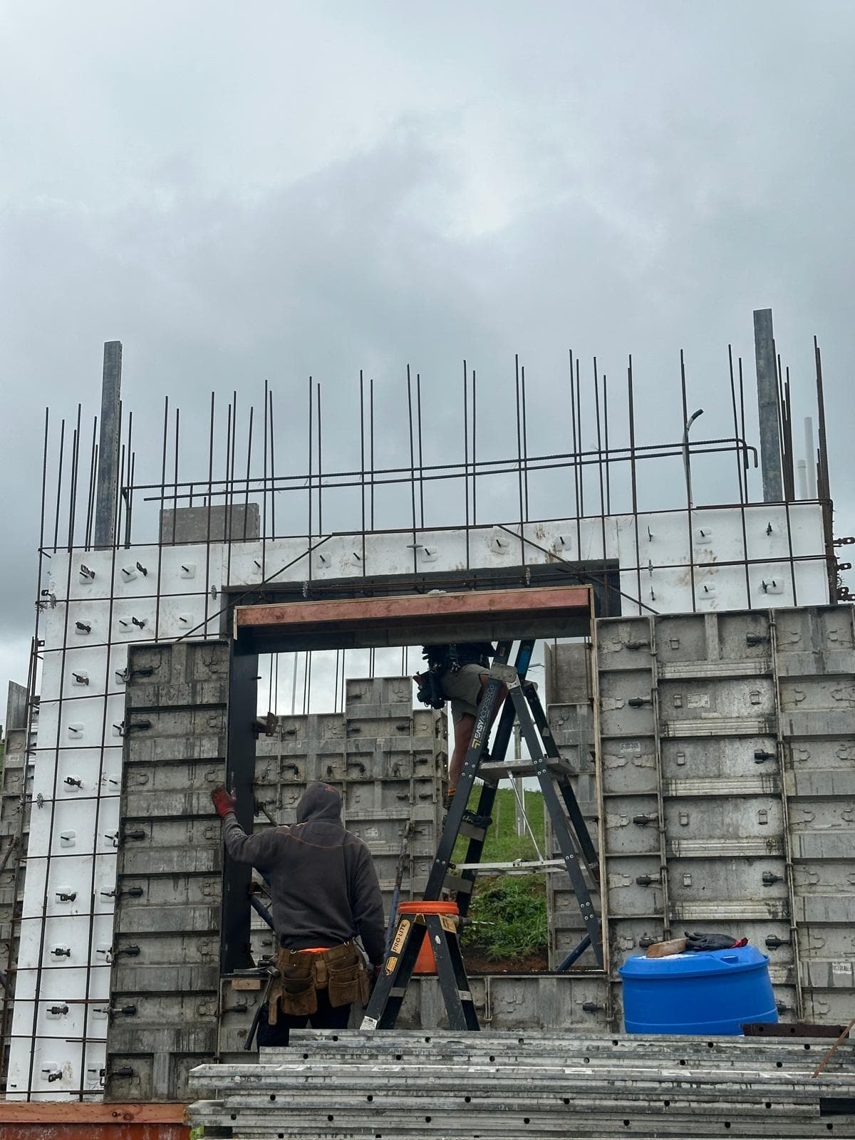 Worker setting formwork around doorway opening